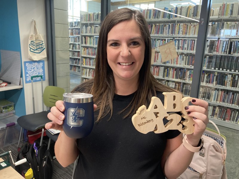 Teacher holding gifts made in The Studio